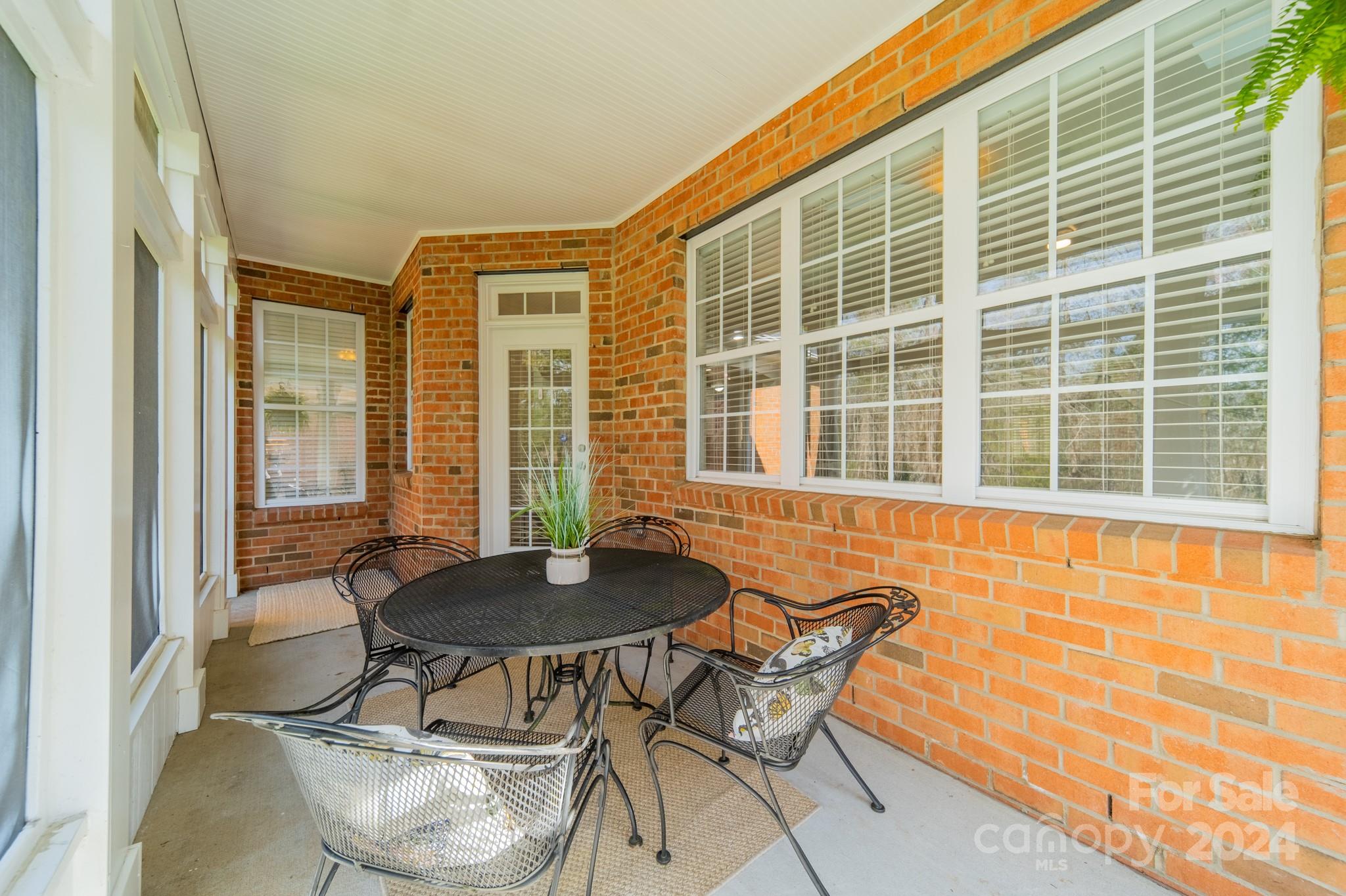 10806 Round Rock Road Charlotte, NC 28277 - Photo 38 of 41 a dining room with furniture and windows