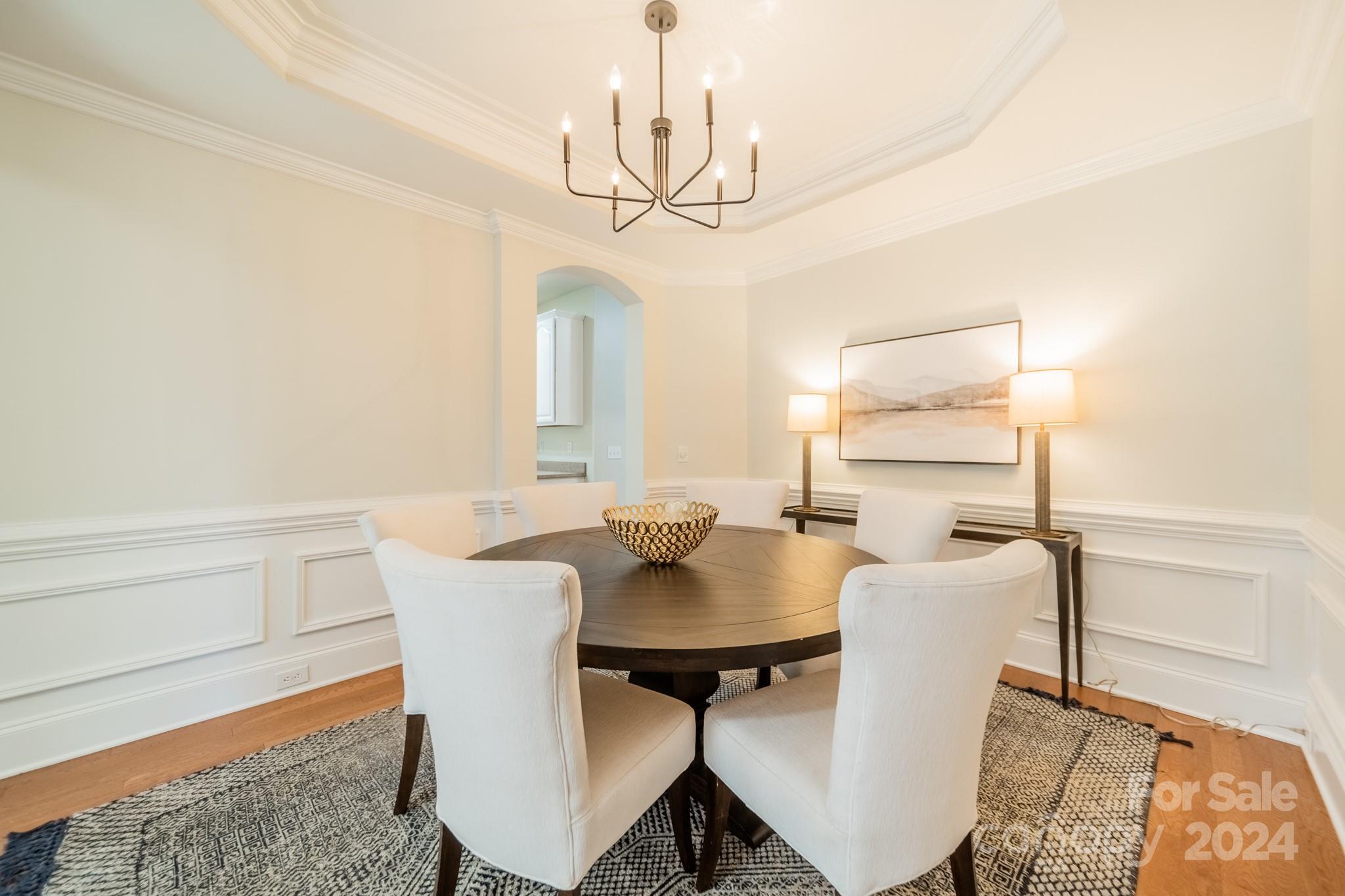 10806 Round Rock Road Charlotte, NC 28277 - Photo 6 of 41 a view of a dining room with furniture and wooden floor