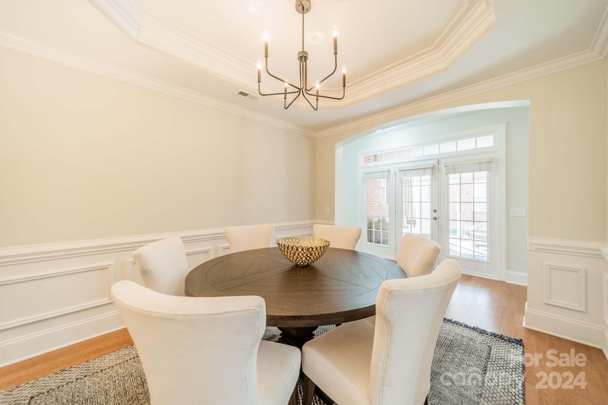 10806 Round Rock Road Charlotte, NC 28277 - Photo 7 of 41 a view of a dining room with furniture and wooden floor