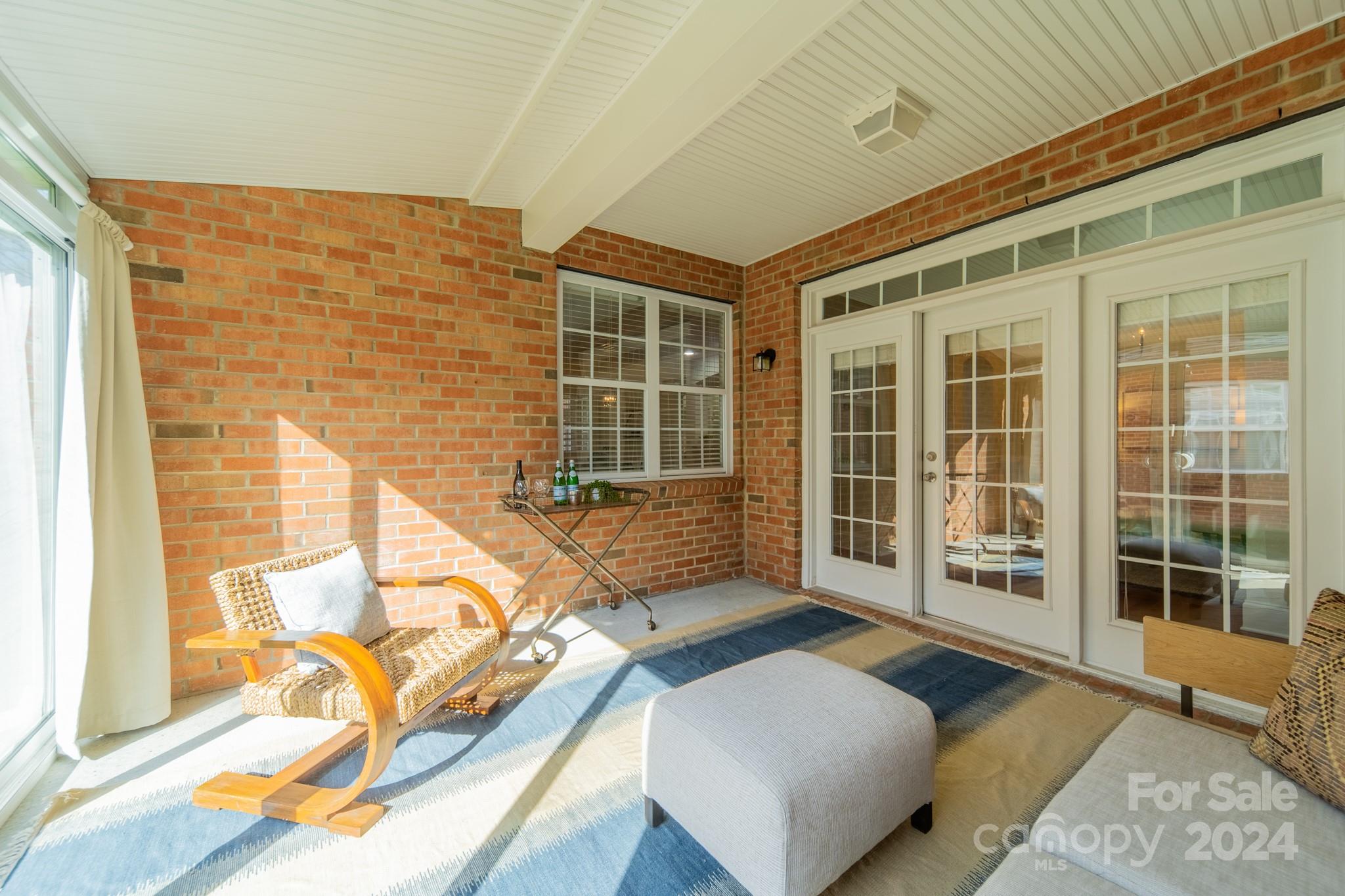 10806 Round Rock Road Charlotte, NC 28277 - Photo 10 of 41 a balcony with furniture and large window