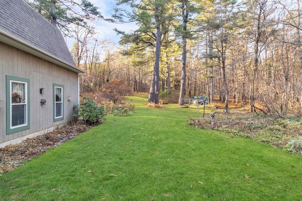 2125 Barre Road Hardwick, MA 01037 - Photo 36 of 42 a backyard of a house with lots of green space and fountain view