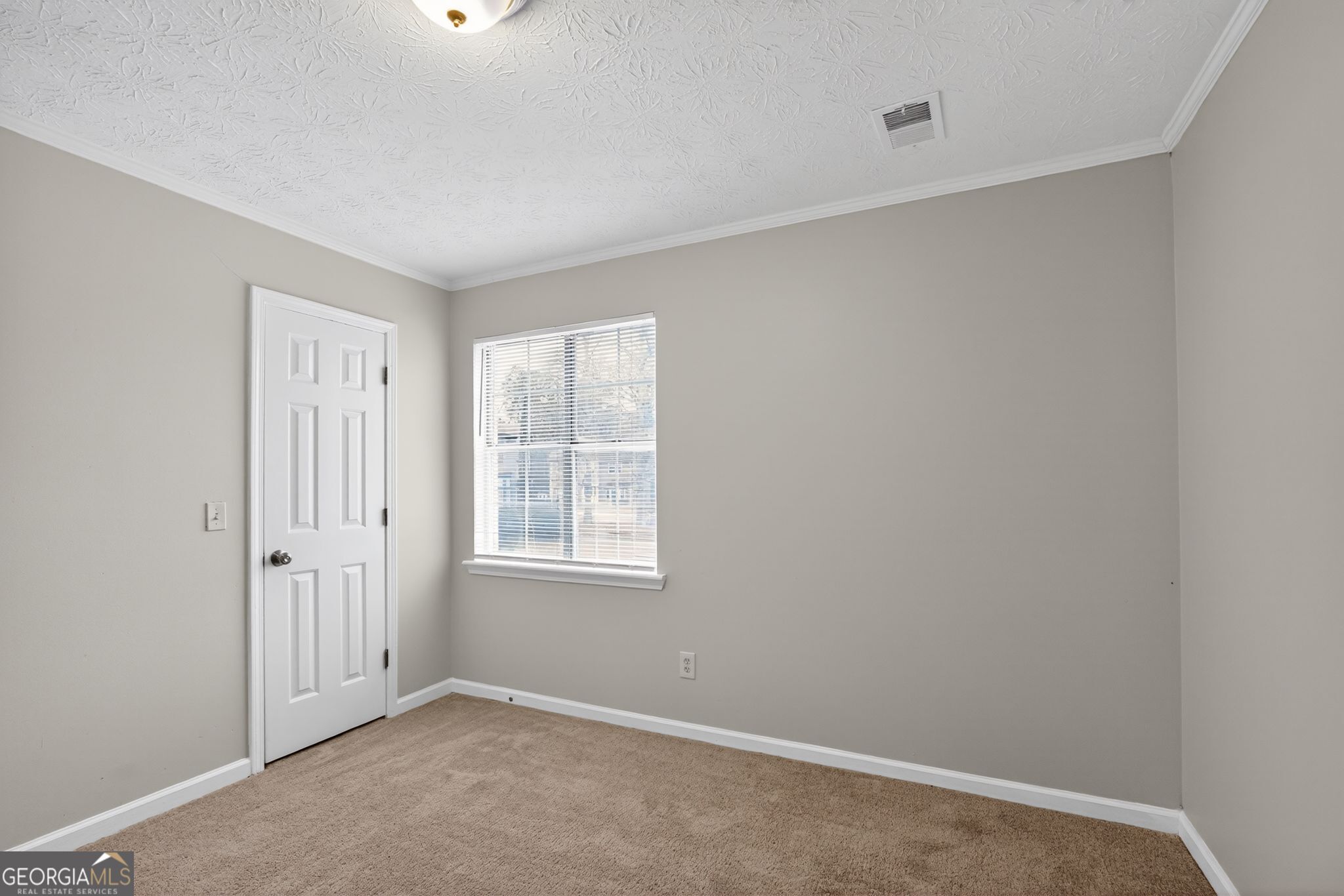 5207 Oaktree Court Lithonia, GA 30038 - Photo 18 of 39 an empty room with windows