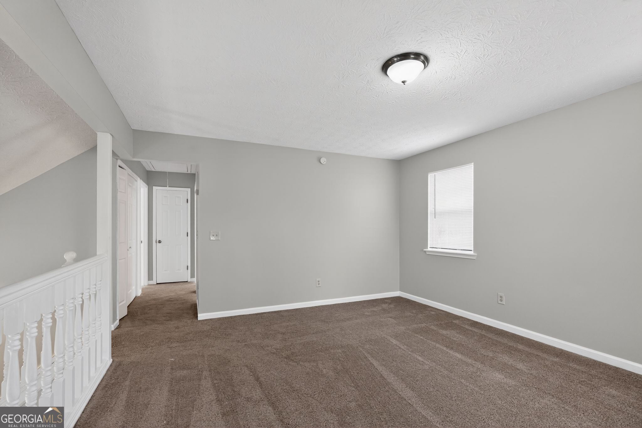 5207 Oaktree Court Lithonia, GA 30038 - Photo 19 of 39 a view of an empty room with a window