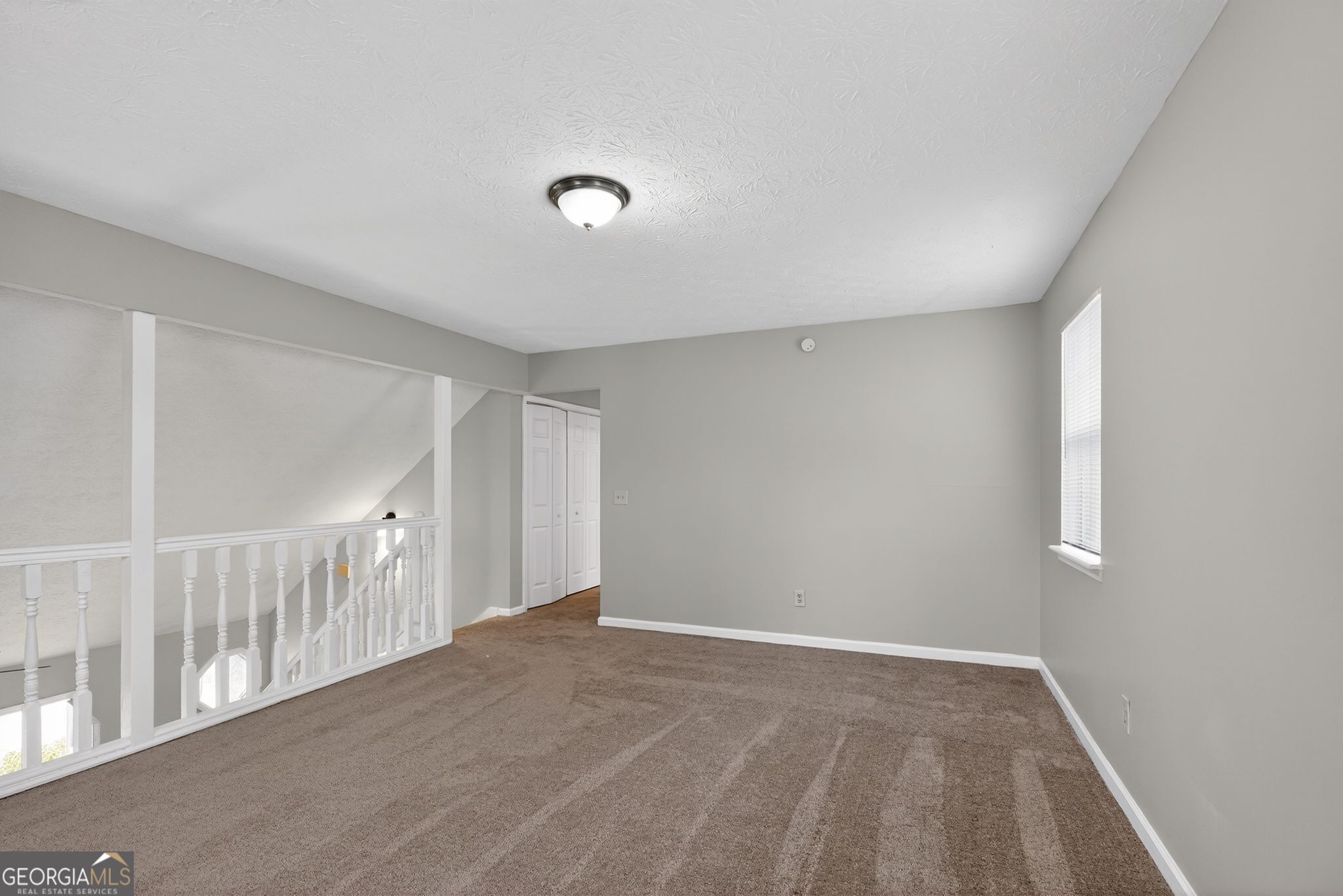 5207 Oaktree Court Lithonia, GA 30038 - Photo 22 of 39 a view of livingroom with stairs