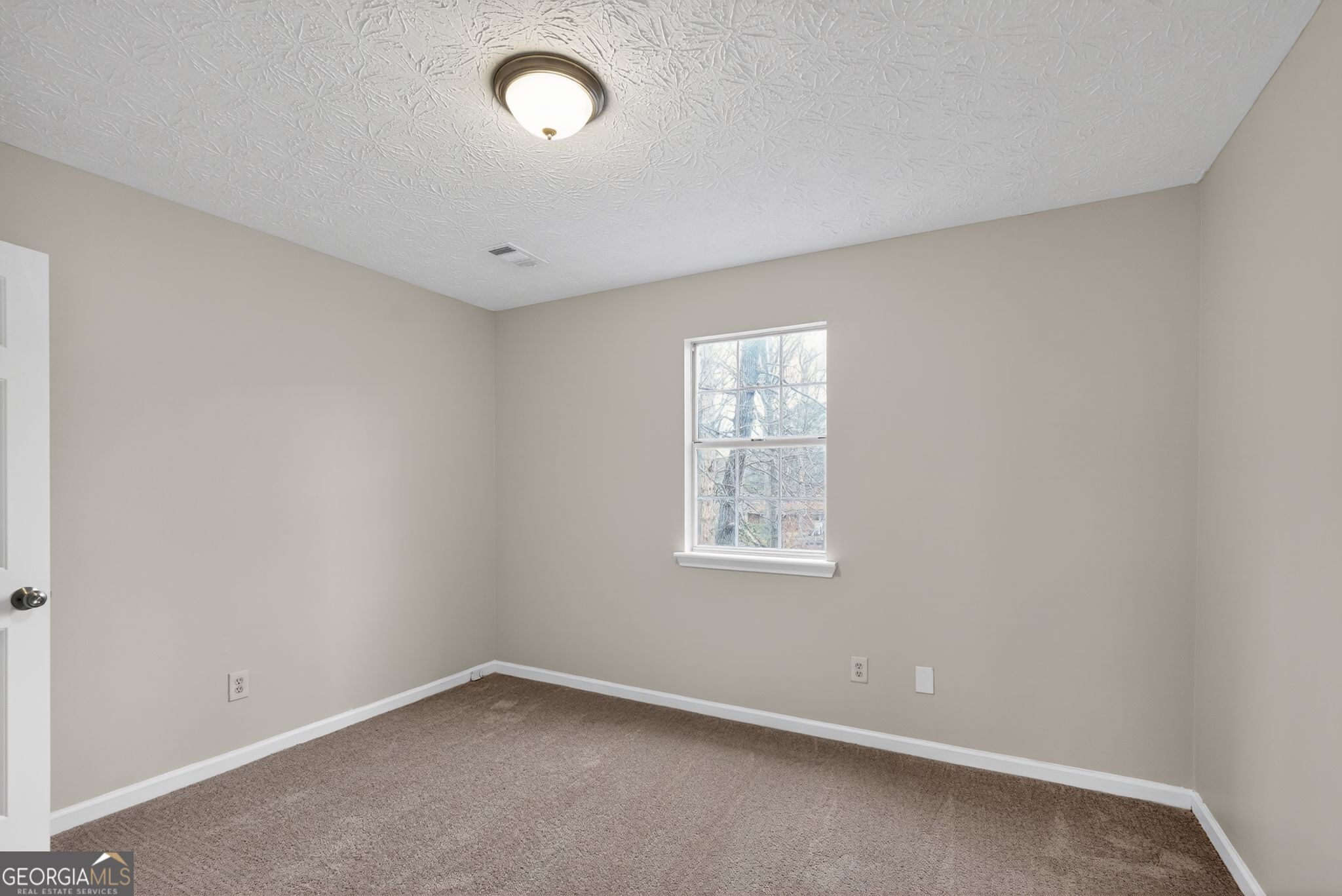 5207 Oaktree Court Lithonia, GA 30038 - Photo 23 of 39 an empty room with windows