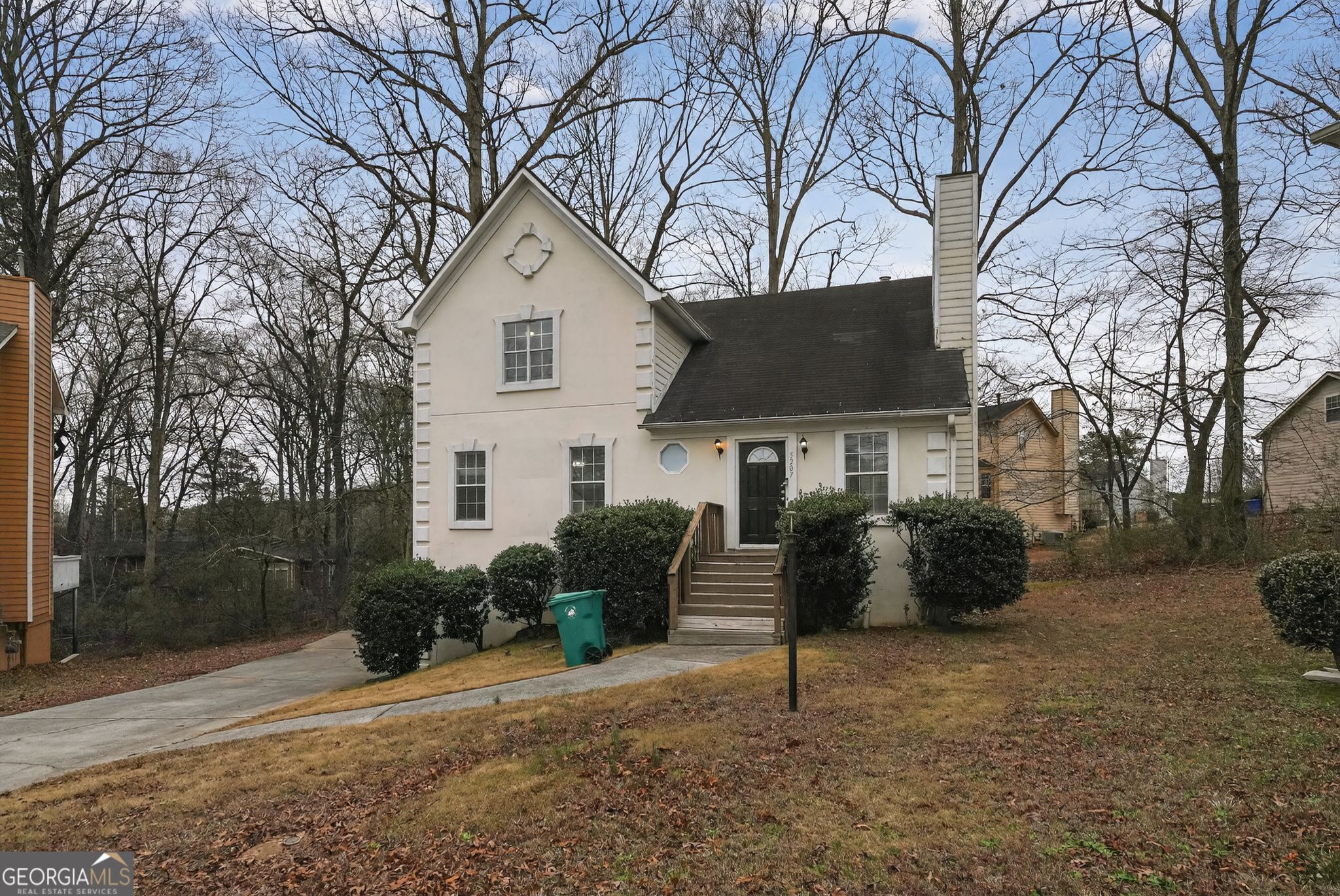 5207 Oaktree Court Lithonia, GA 30038 - Photo 3 of 39 a house that has a tree in front of it