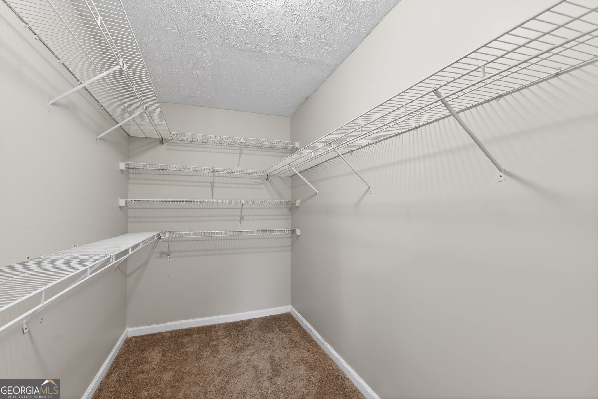 5207 Oaktree Court Lithonia, GA 30038 - Photo 32 of 39 a view of a room with racks on the wall