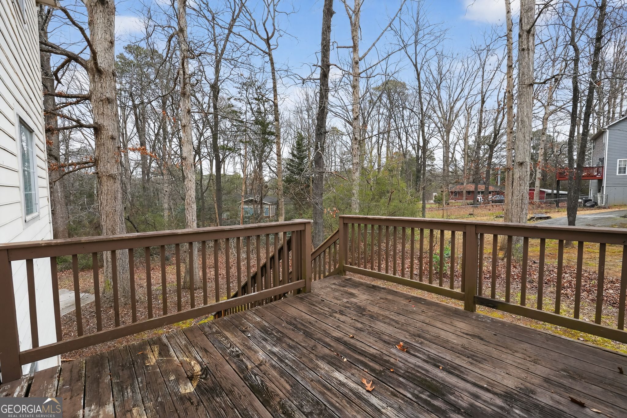 5207 Oaktree Court Lithonia, GA 30038 - Photo 33 of 39 a balcony with wooden floor and fence