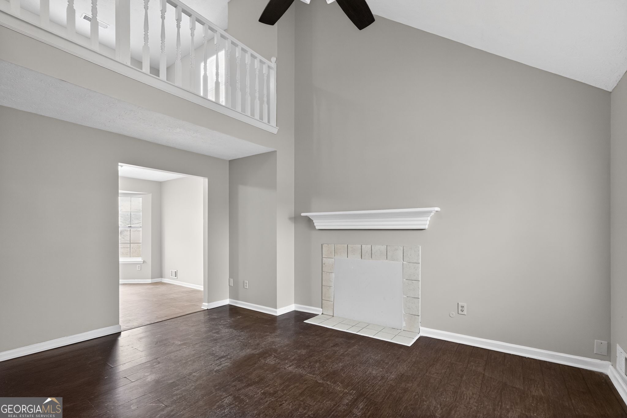 5207 Oaktree Court Lithonia, GA 30038 - Photo 9 of 39 an empty room with wooden floor and windows