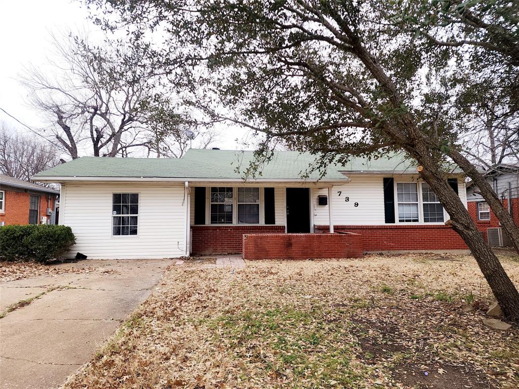 739 South Andrews Avenue Sherman, TX 75090 - Photo 1 of 15 a front view of house with yard and trees in the background