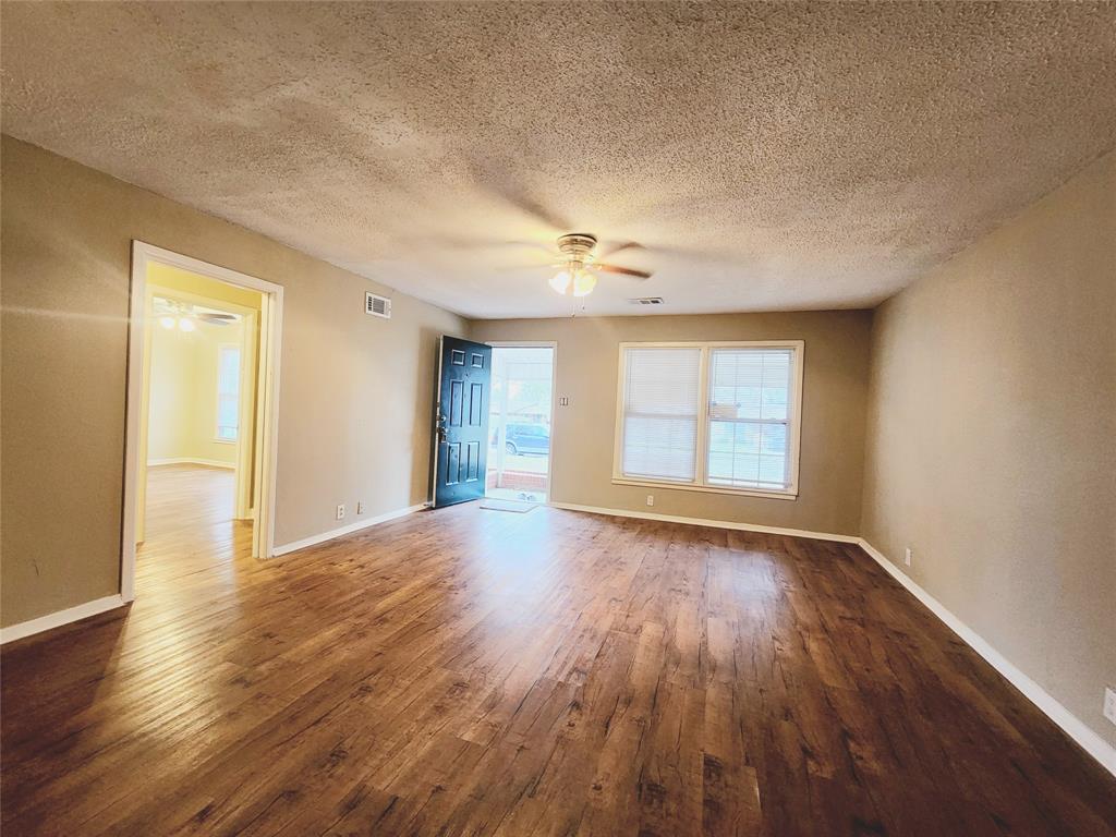 739 South Andrews Avenue Sherman, TX 75090 - Photo 15 of 15 a view of an empty room with wooden floor and a window