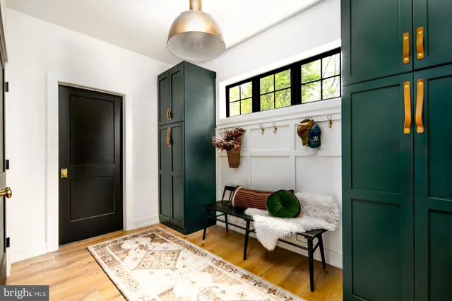 a view of a livingroom with furniture and front door