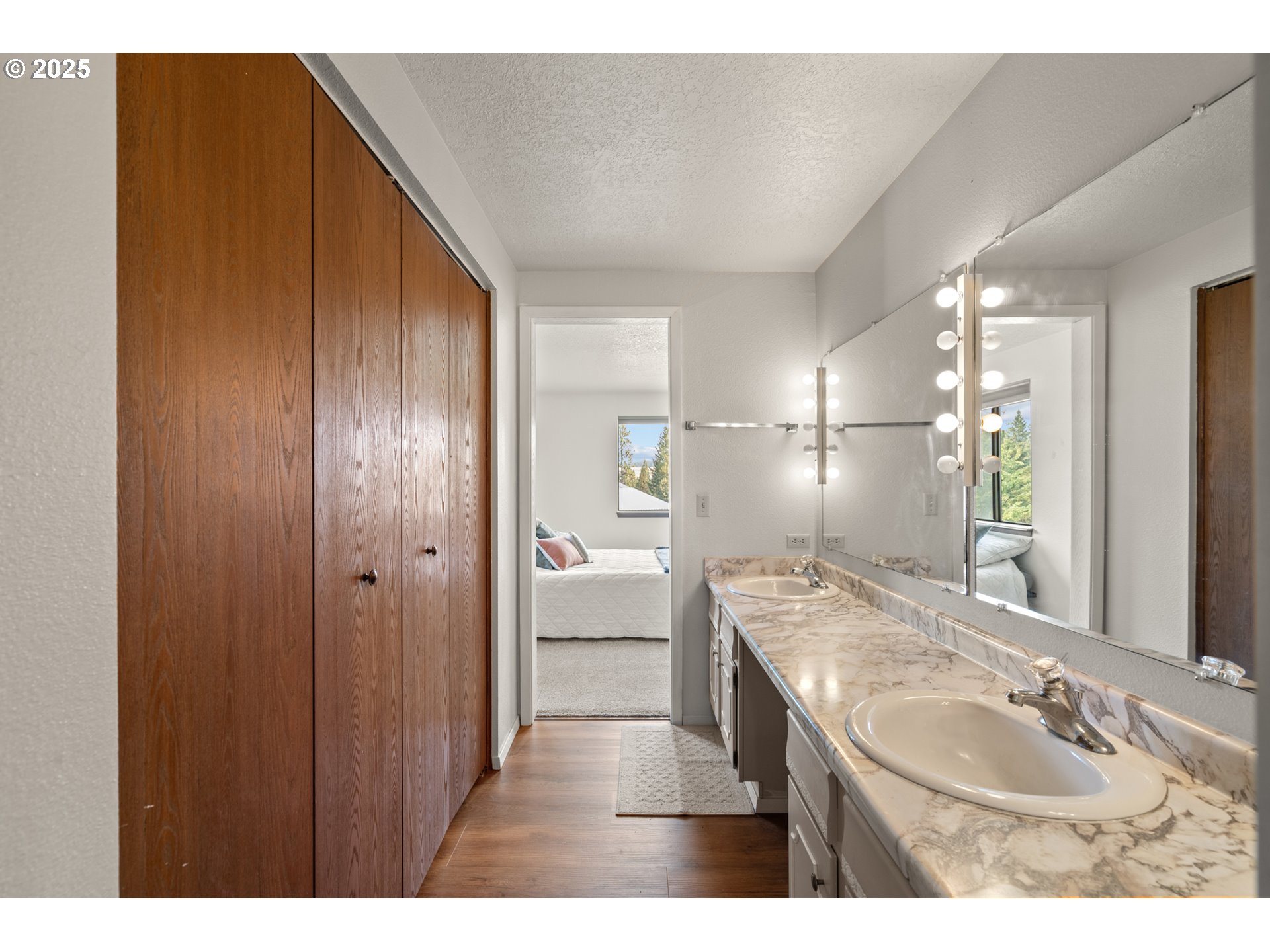 49414 County 1028 Road Pendleton, OR 97801 - Photo 26 of 46 a bathroom with a sink double vanity granite tub shower and a mirror