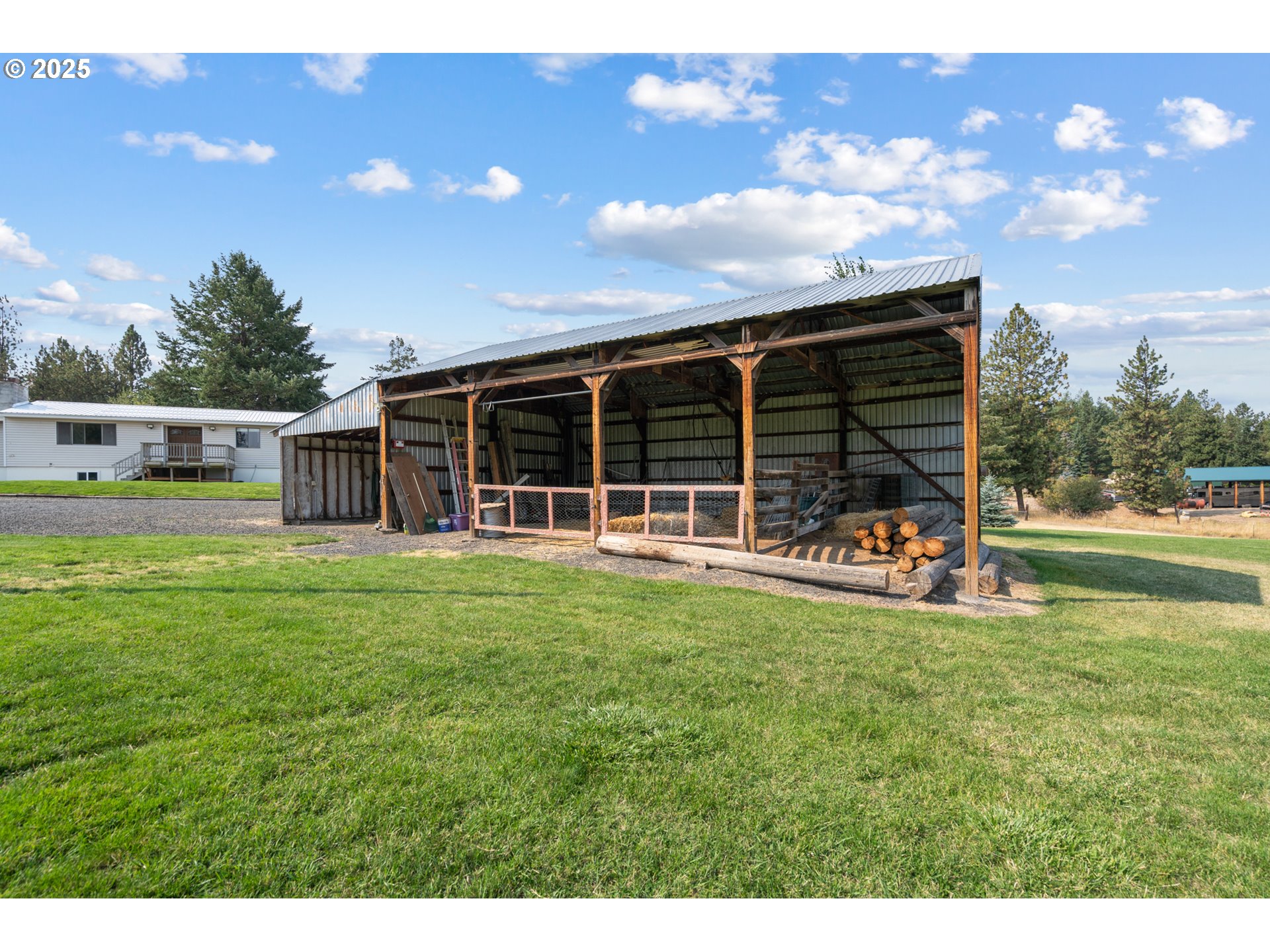 49414 County 1028 Road Pendleton, OR 97801 - Photo 42 of 46 a view of a house with a backyard porch and sitting area