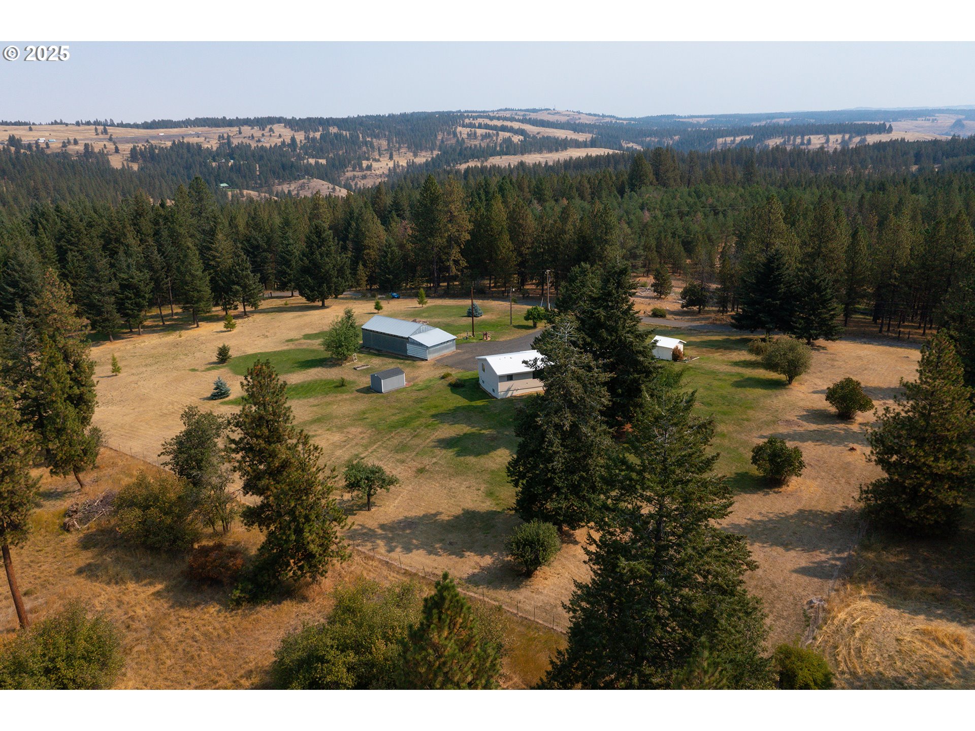 49414 County 1028 Road Pendleton, OR 97801 - Photo 5 of 46 a view of a lake with mountains in the background