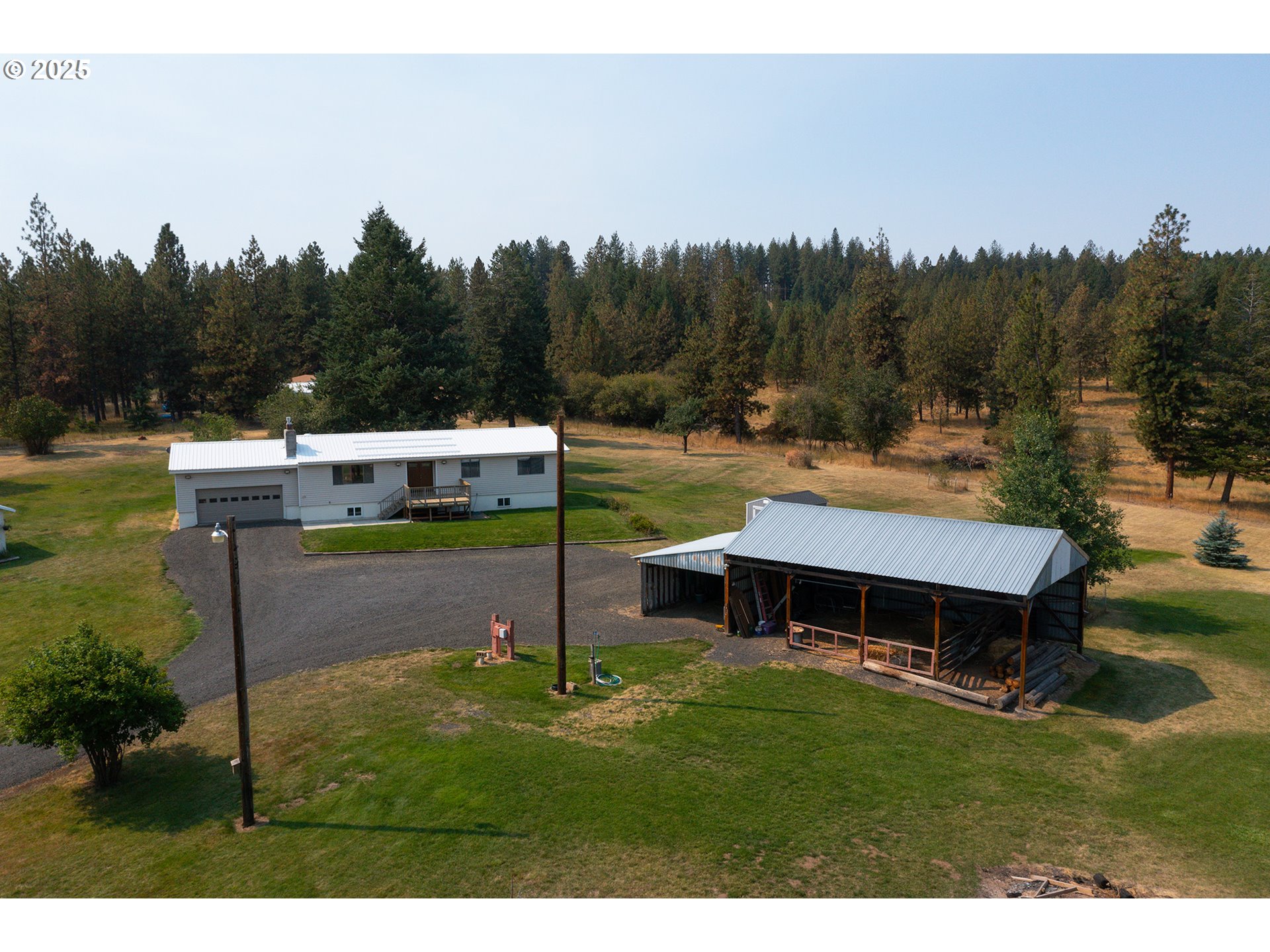 49414 County 1028 Road Pendleton, OR 97801 - Photo 7 of 46 a backyard of a house with table and chairs