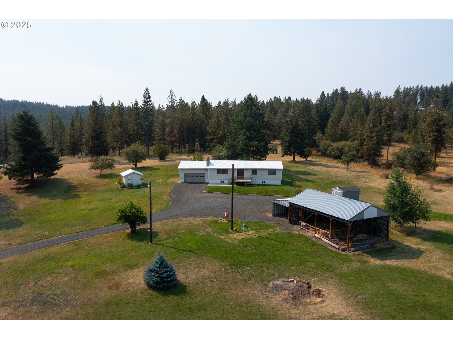 49414 County 1028 Road Pendleton, OR 97801 - Photo 8 of 46 a swimming pool with outdoor seating and yard