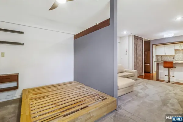 a bedroom with a bed and a view of bathroom