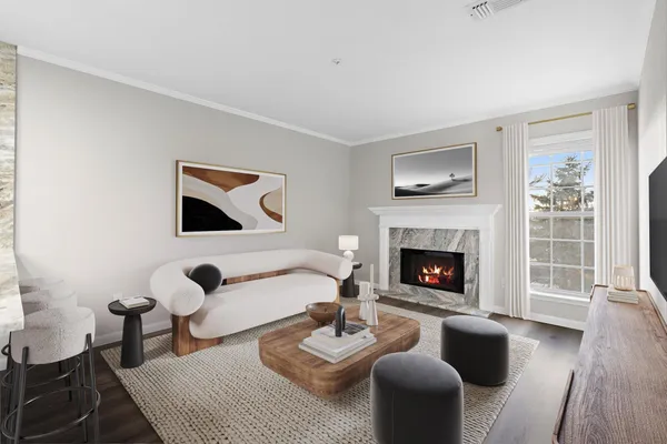 a living room with furniture and a fireplace