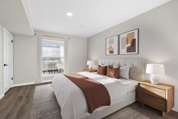 a bed room with a bed and a night stand