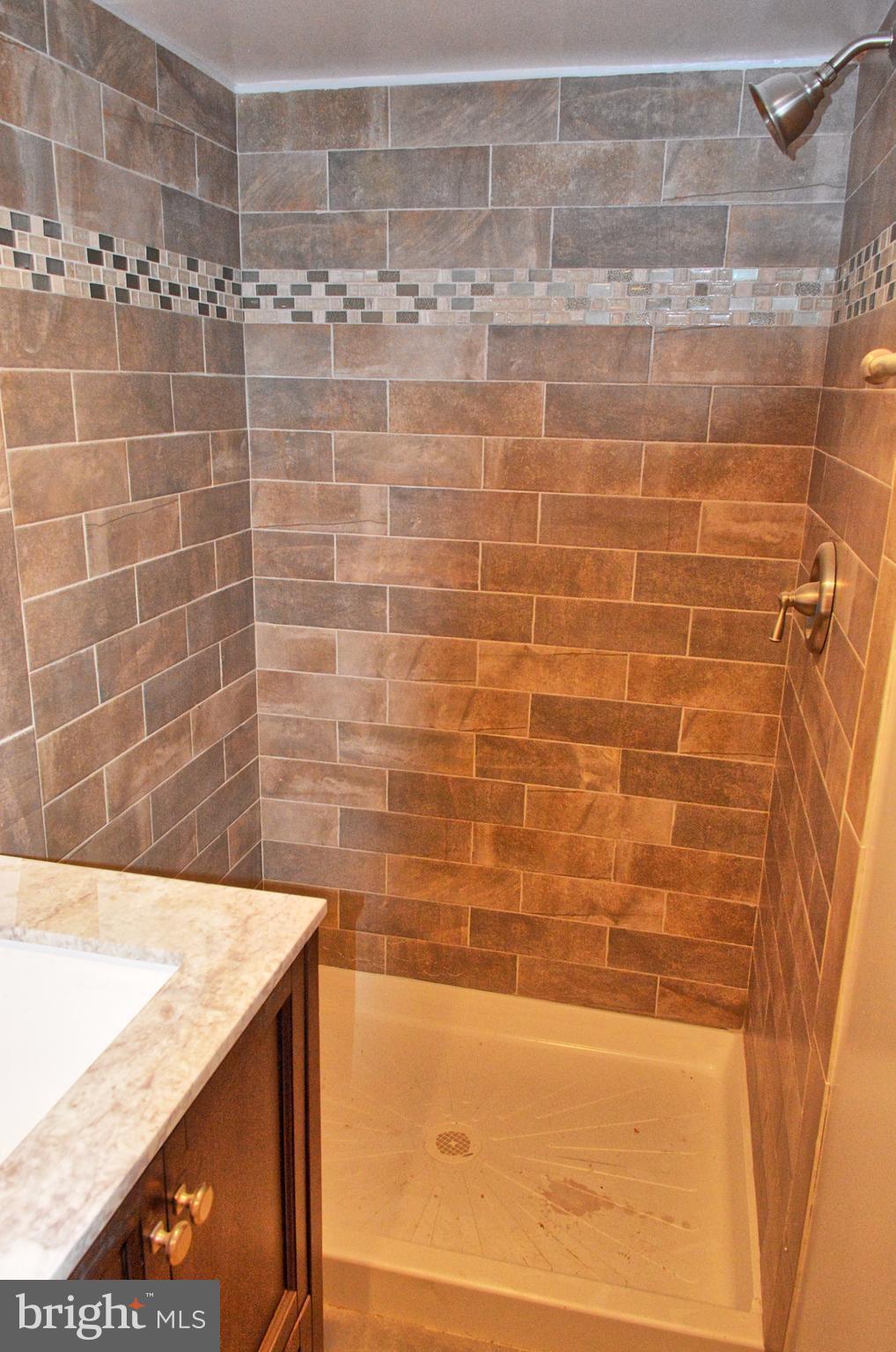 12408 Regwood Road Hydes, MD 21082 - Photo 13 of 17 a bathroom with a bathtub