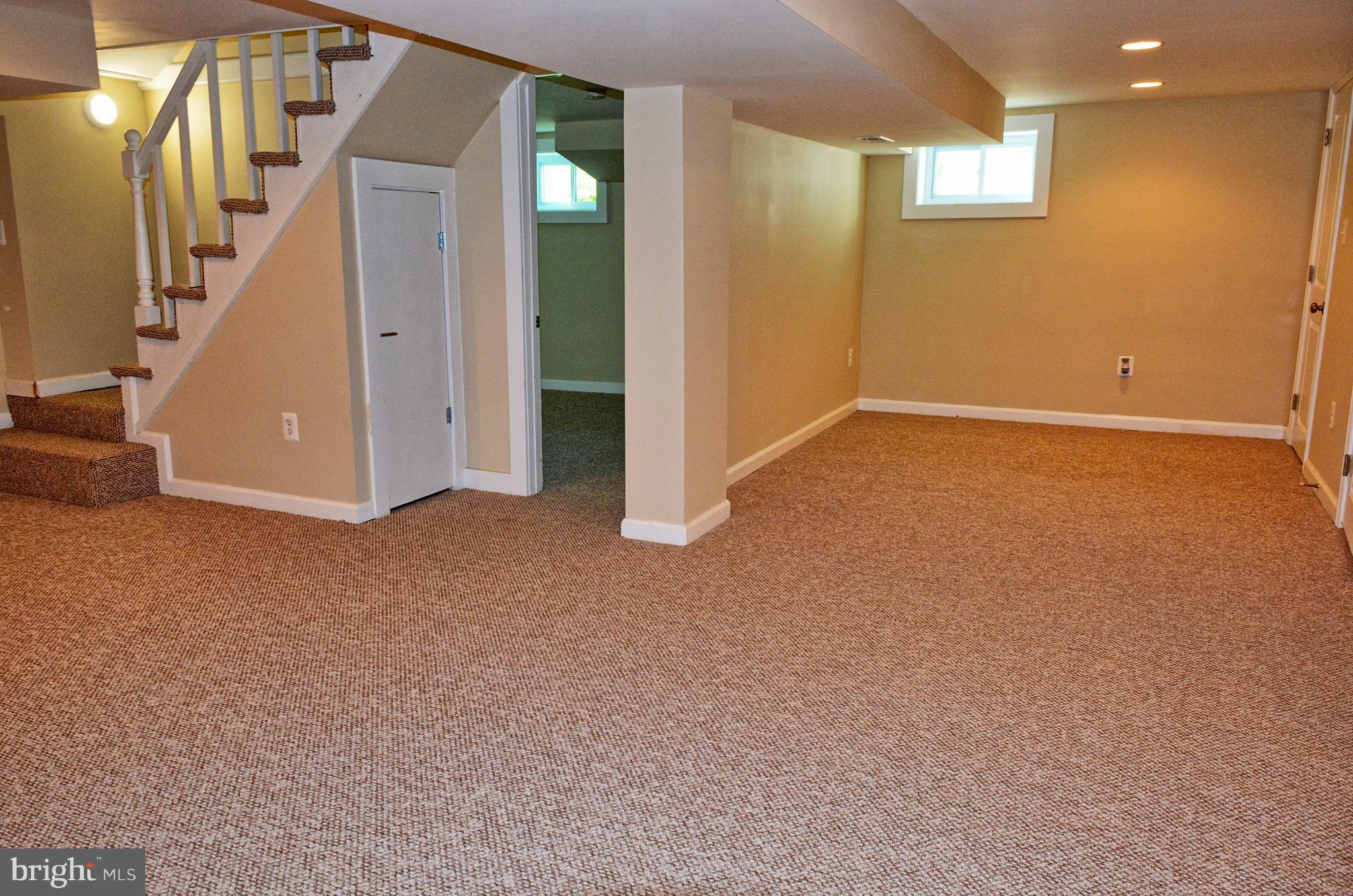 12408 Regwood Road Hydes, MD 21082 - Photo 14 of 17 a view of an empty room with stairs