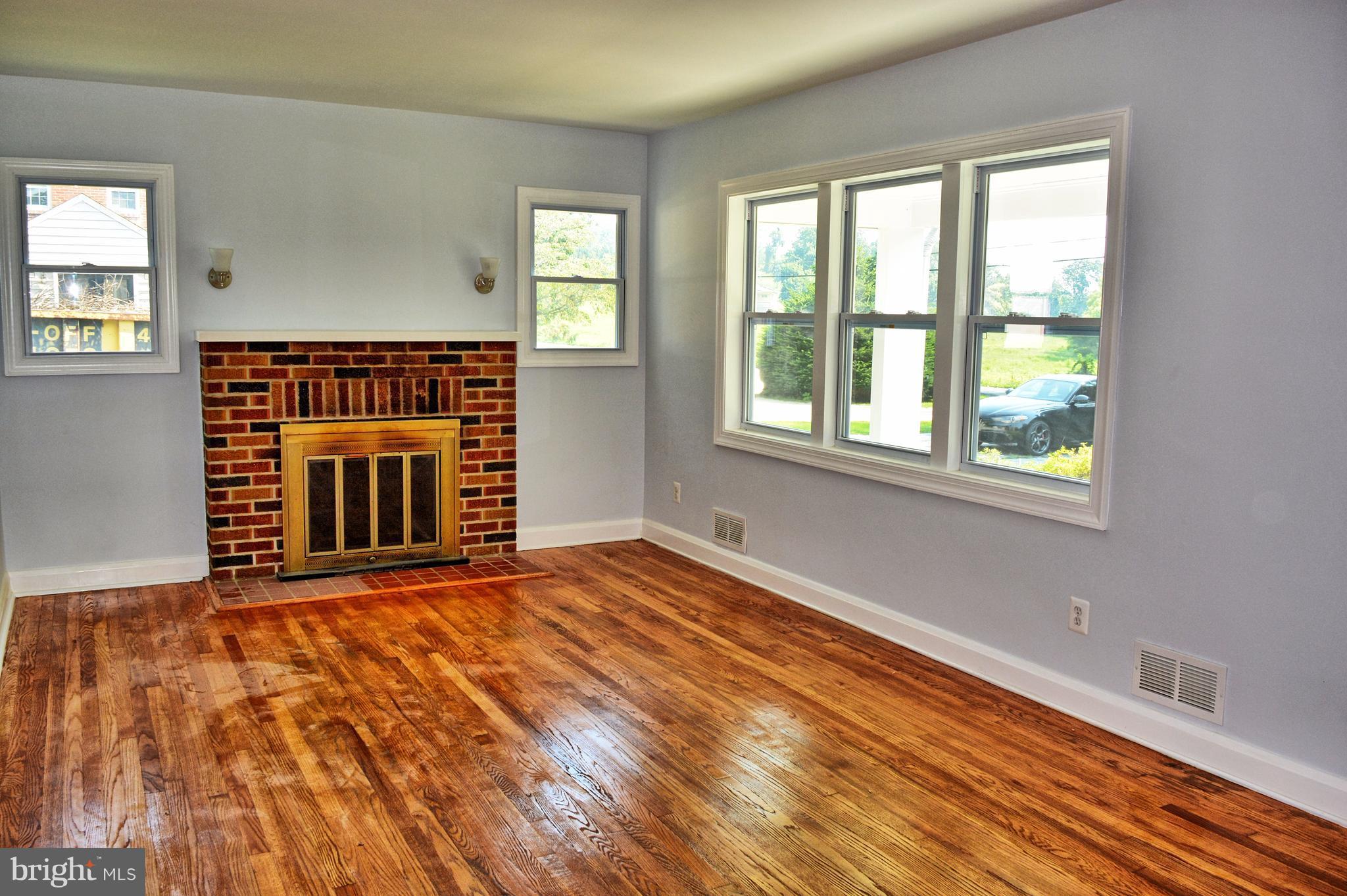 12408 Regwood Road Hydes, MD 21082 - Photo 3 of 17 a front view of a house with a balcony