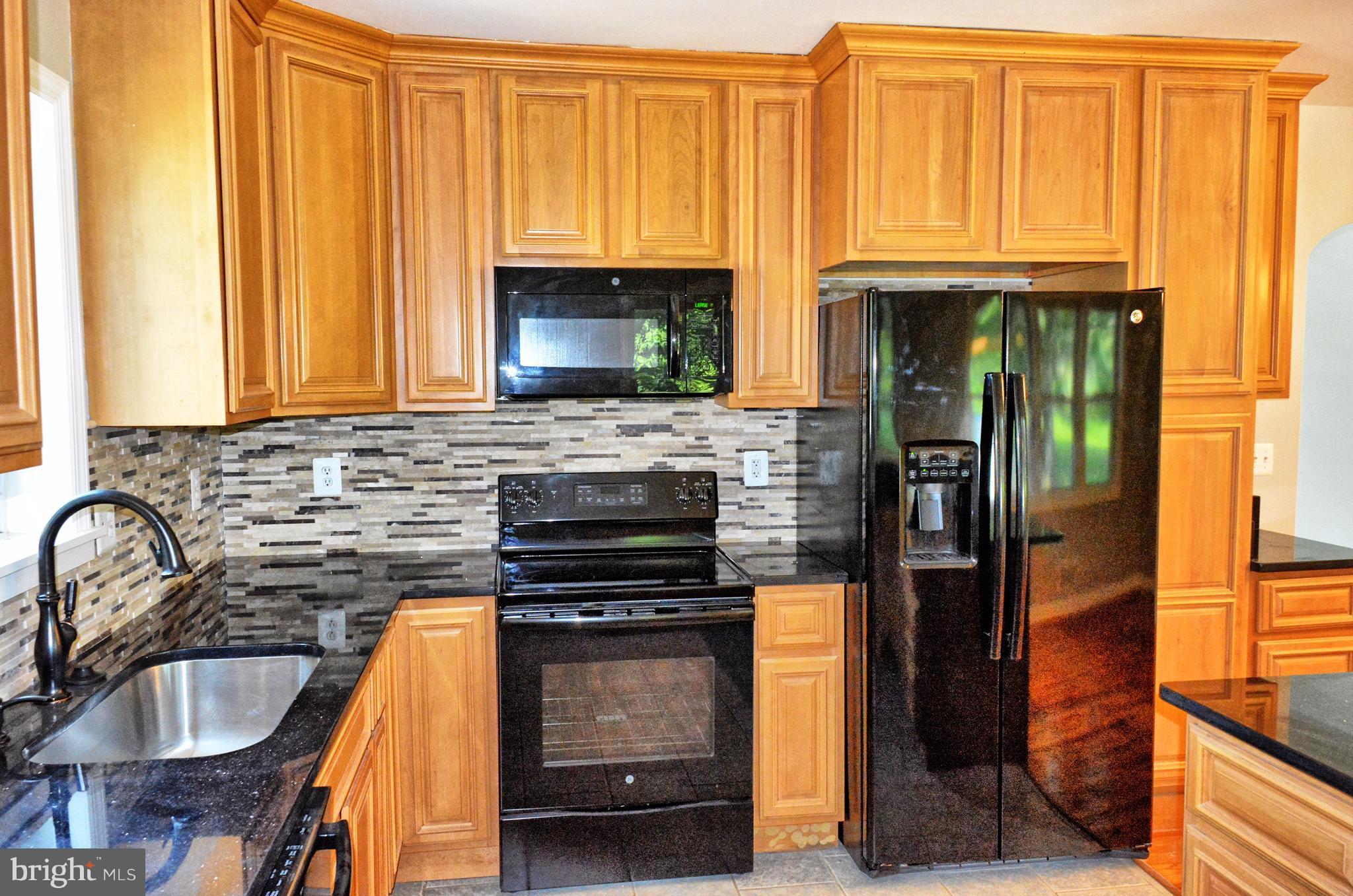 12408 Regwood Road Hydes, MD 21082 - Photo 4 of 17 a kitchen with windows and a sink