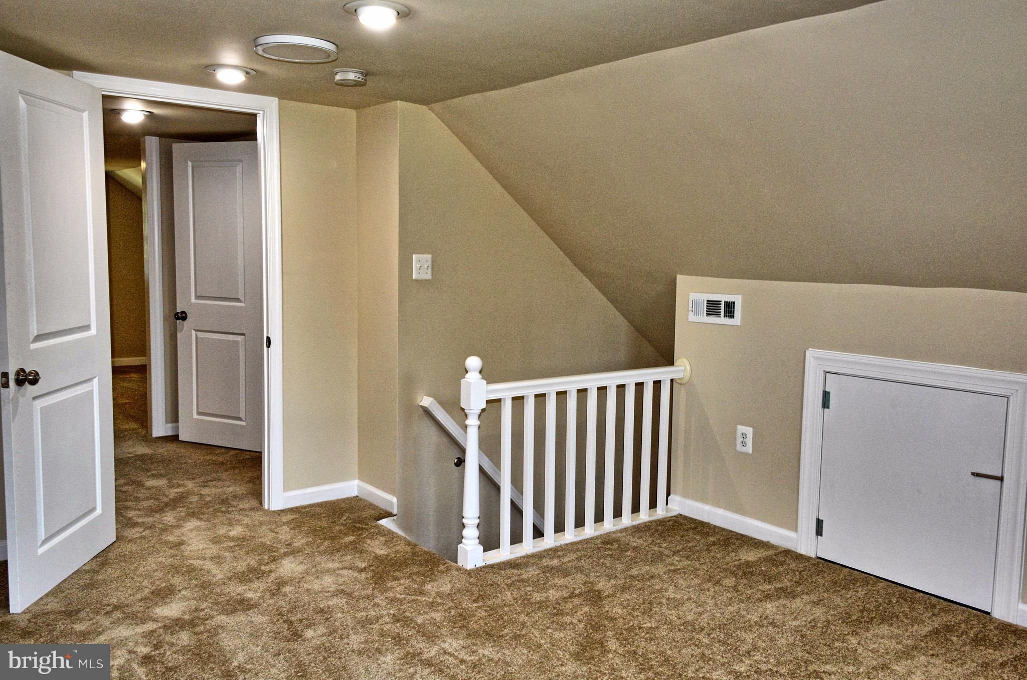 12408 Regwood Road Hydes, MD 21082 - Photo 10 of 17 an empty room with windows and entryway