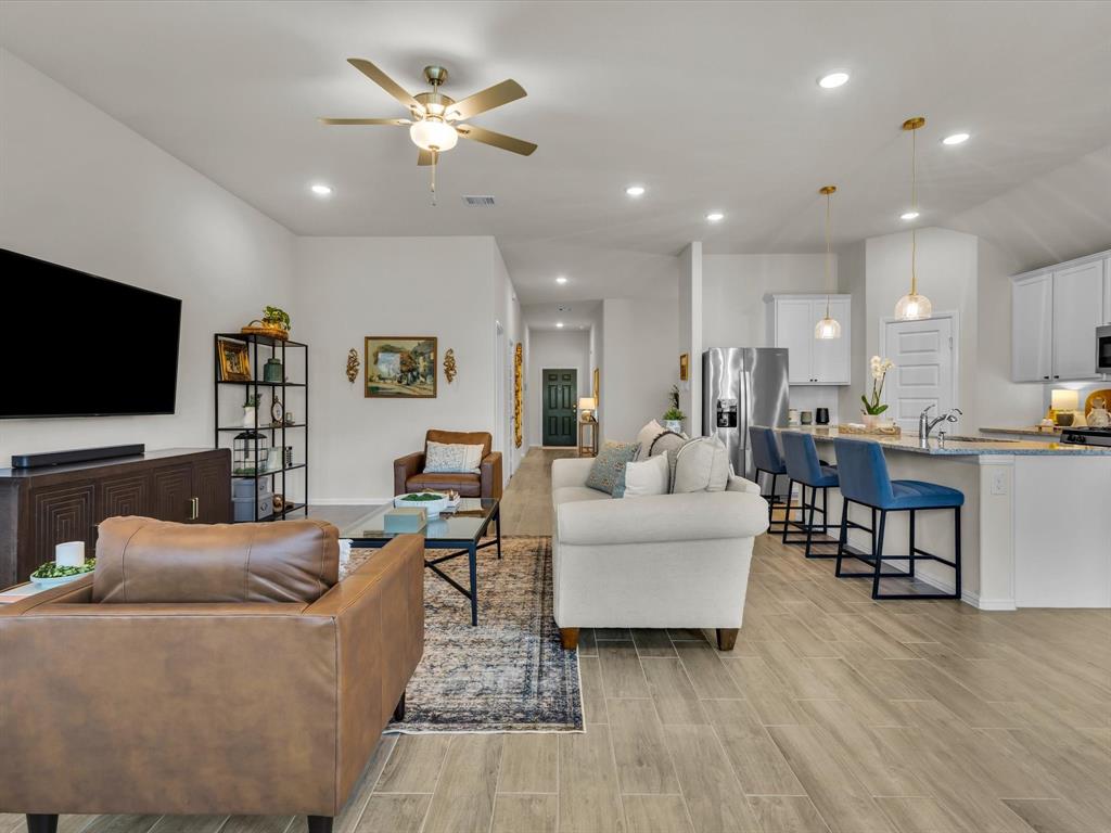 13141 Yellowstone Way Providence Village, TX 76227 - Photo 39 of 40 a living room with furniture and a flat screen tv