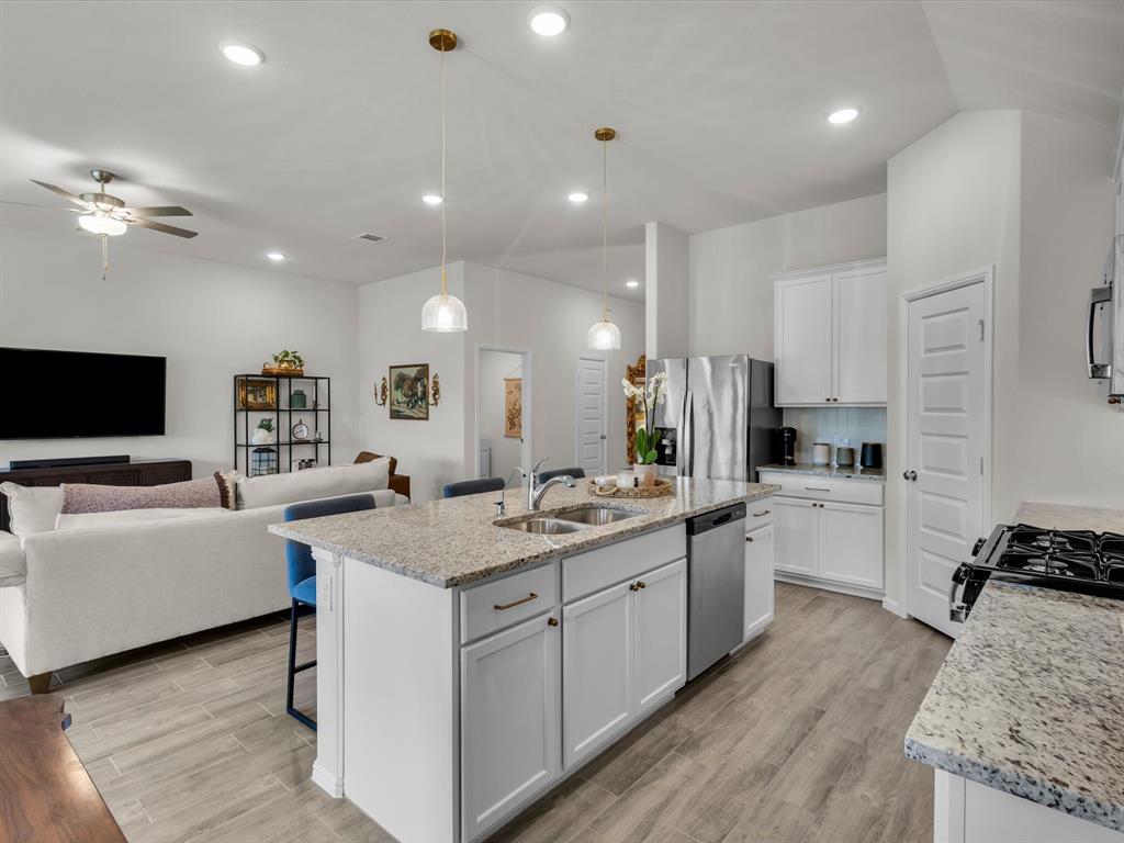 13141 Yellowstone Way Providence Village, TX 76227 - Photo 14 of 40 a kitchen with a sink appliances and cabinets