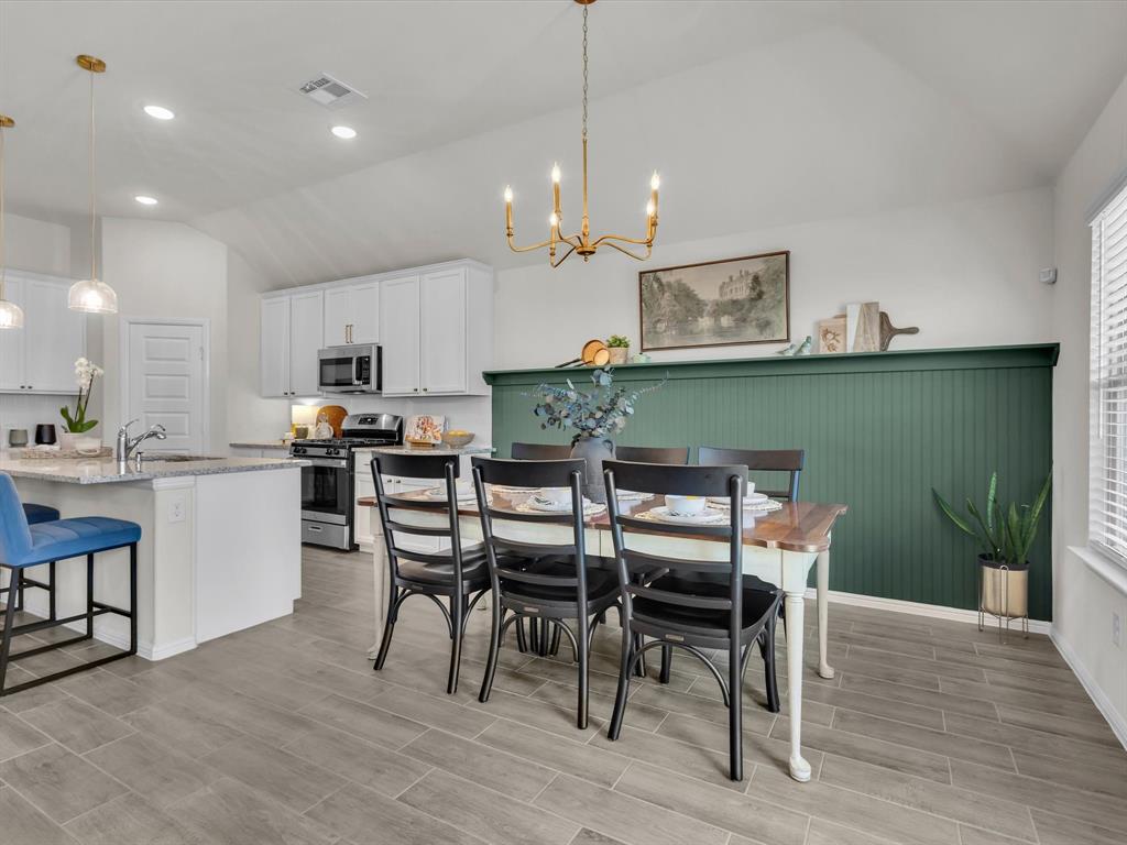 13141 Yellowstone Way Providence Village, TX 76227 - Photo 19 of 40 a view of a dining room with furniture and wooden floor