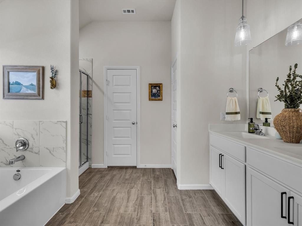 13141 Yellowstone Way Providence Village, TX 76227 - Photo 24 of 40 a bathroom with a bathtub and a sink