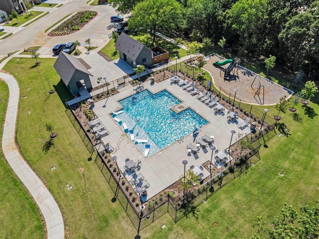 13141 Yellowstone Way Providence Village, TX 76227 - Photo 37 of 40 an aerial view of a swimming pool with a yard and mountain view