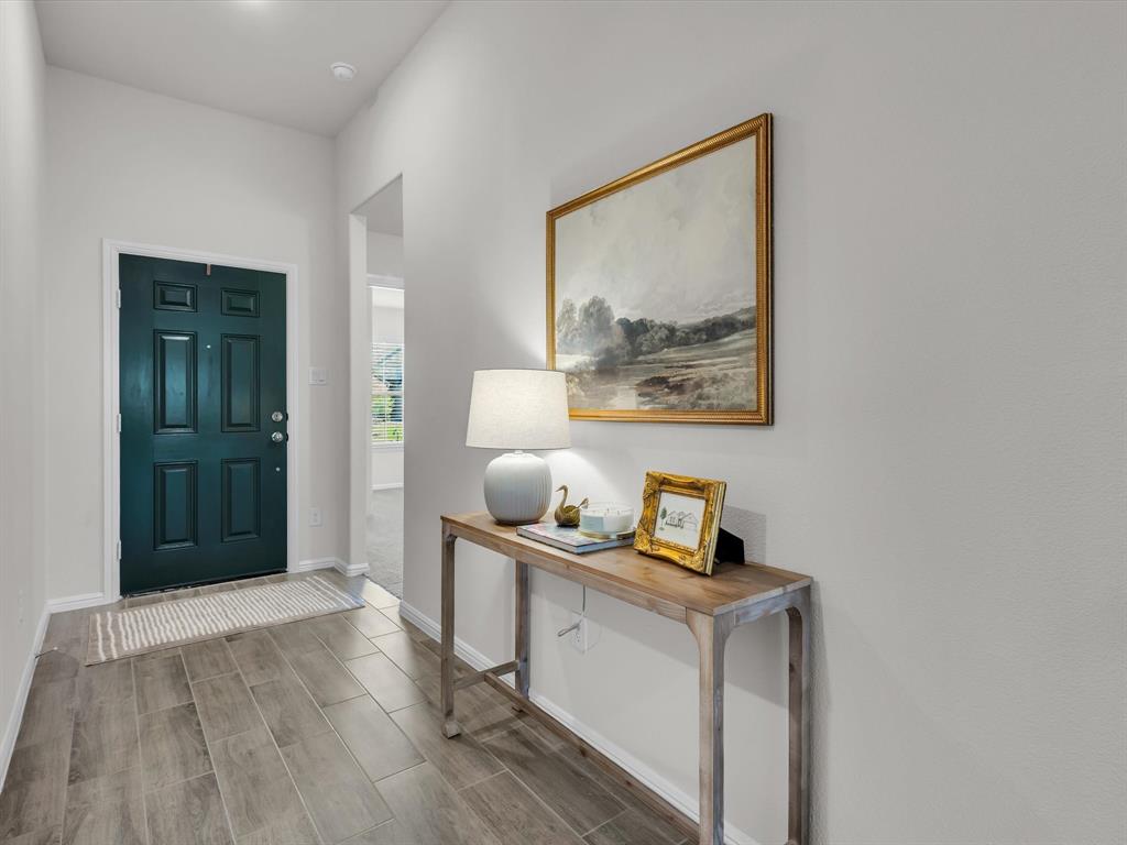 13141 Yellowstone Way Providence Village, TX 76227 - Photo 4 of 40 a view of room with window and wooden floor