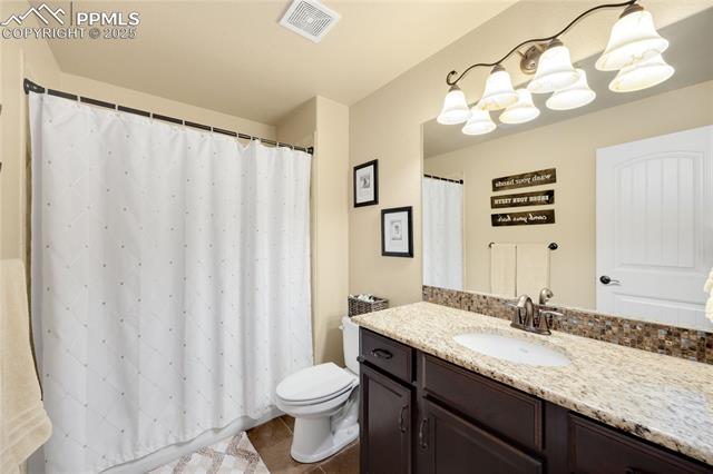 1131 Old North Gate Road Colorado Springs, CO 80921 - Photo 30 of 39 Full bath featuring vanity, tile floors, and shower