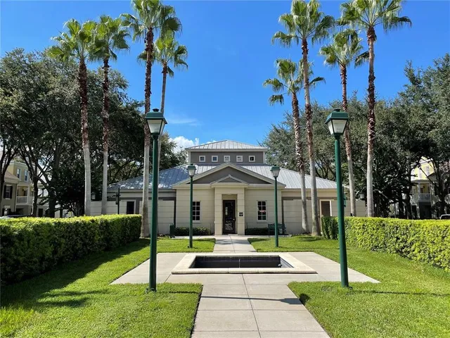 a living room with a black white checkered floor with couches chair and a coffee table