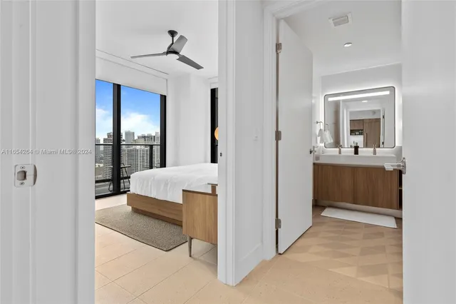 a large white bed in a white room