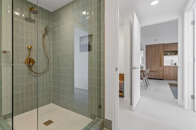 a lobby with furniture and floor to ceiling window