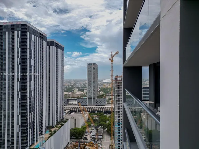 a view of balcony with furniture and garden