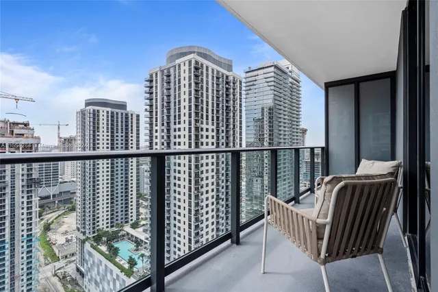 a view of a balcony with furniture