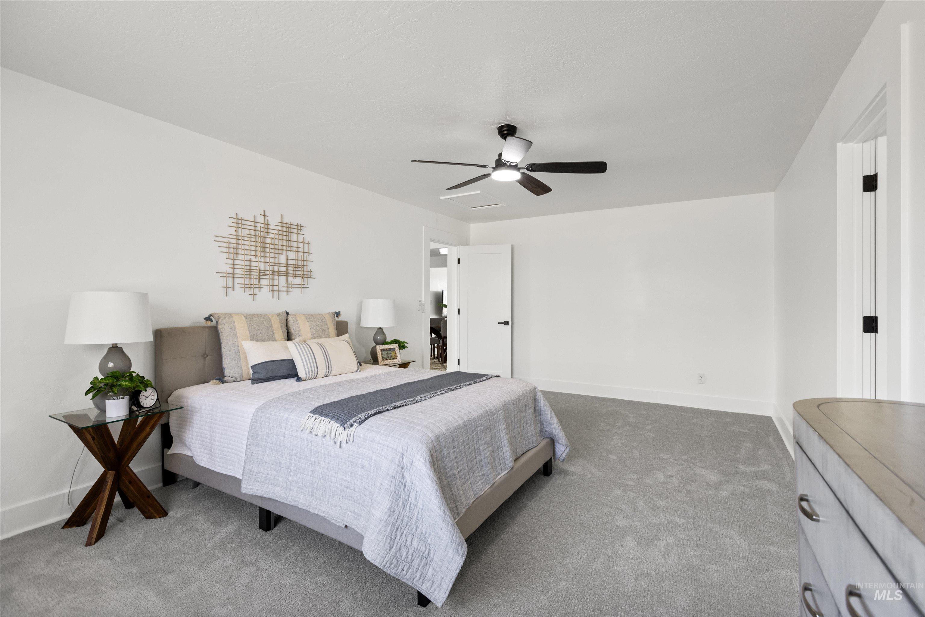 29862 Emmett Road Caldwell, ID 83607 - Photo 20 of 44 Bedroom featuring carpet and a ceiling fan