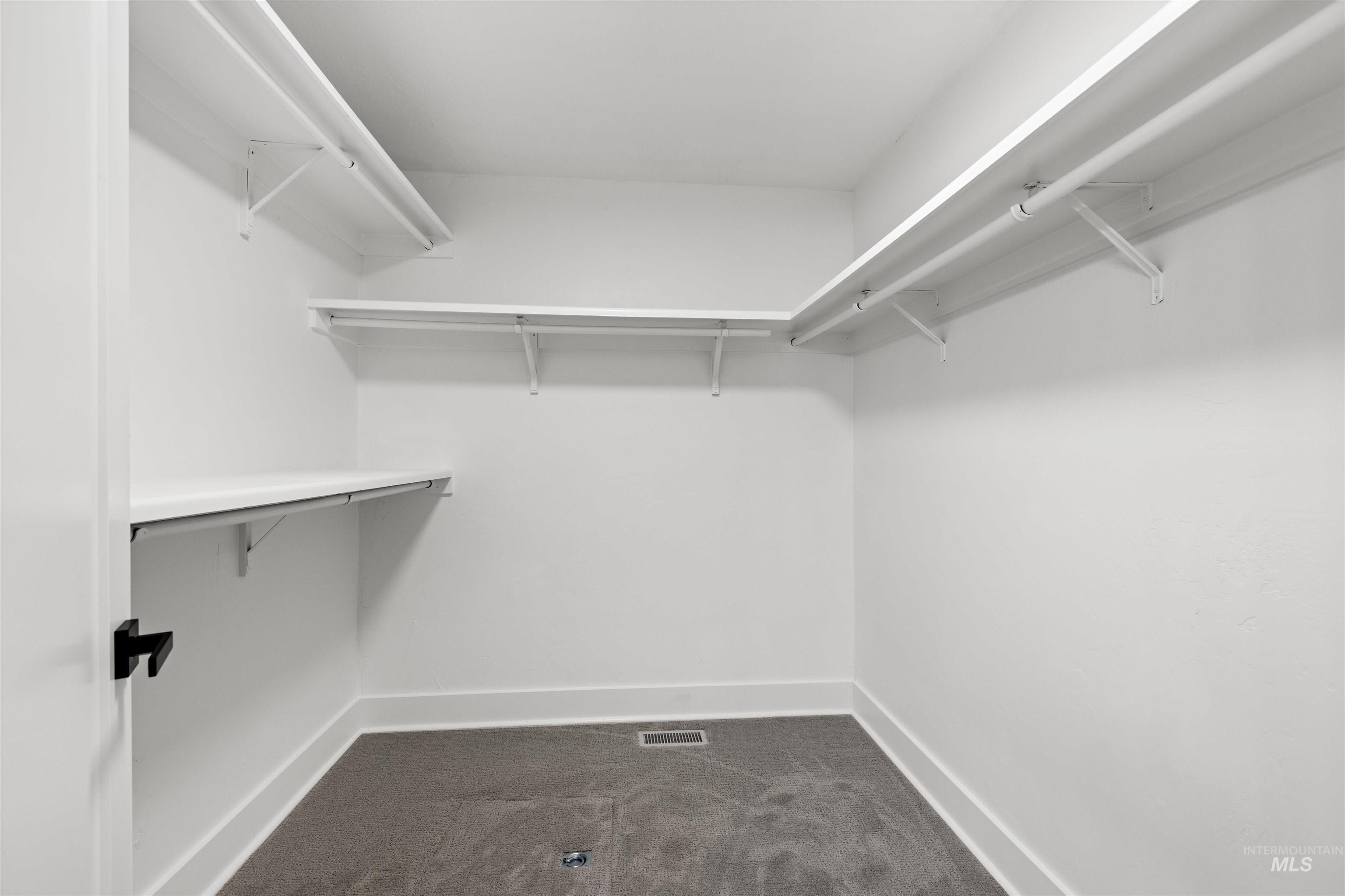 29862 Emmett Road Caldwell, ID 83607 - Photo 23 of 44 Walk in closet featuring dark carpet
