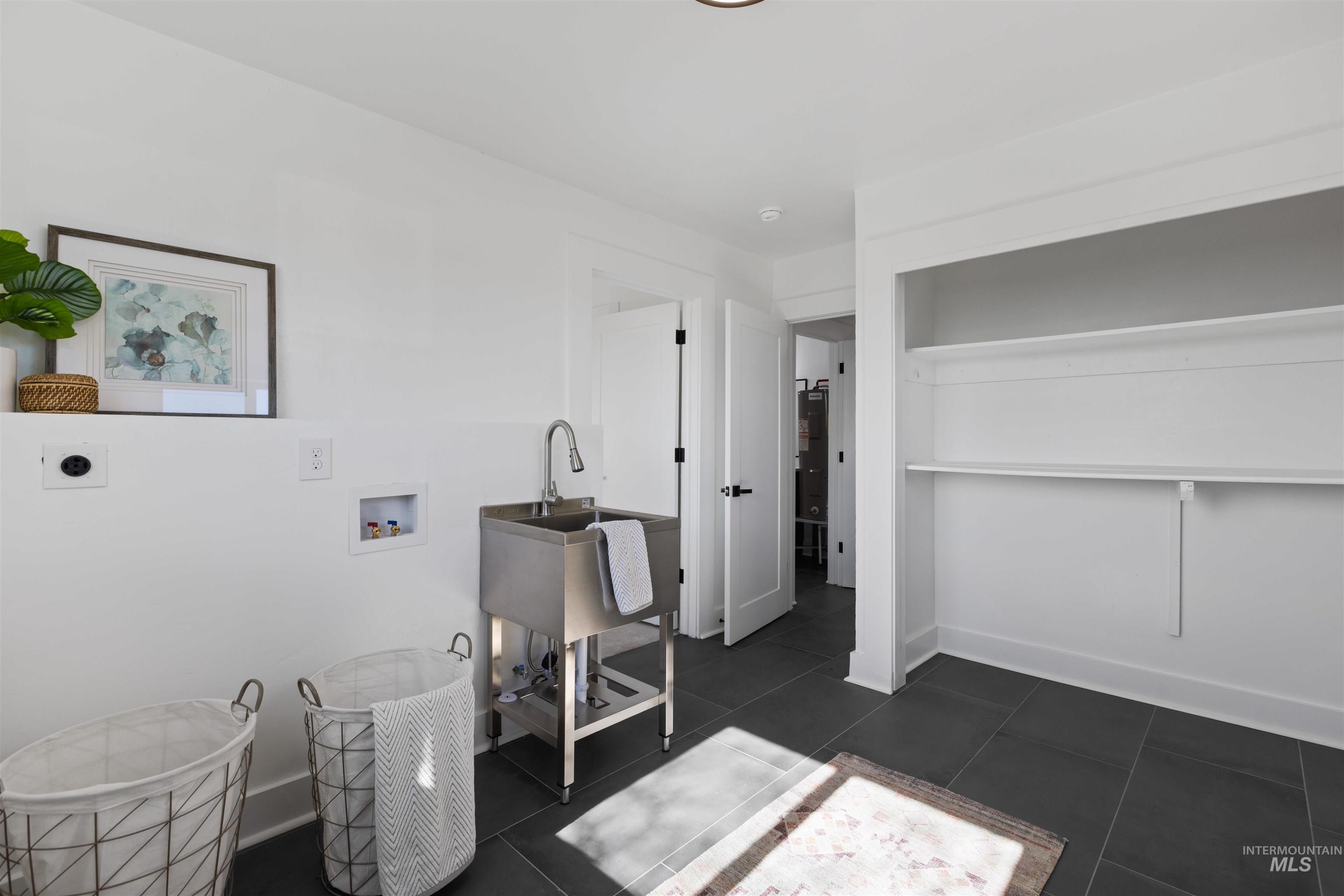 29862 Emmett Road Caldwell, ID 83607 - Photo 39 of 44 Laundry room with hookup for a washing machine and dark tile patterned flooring