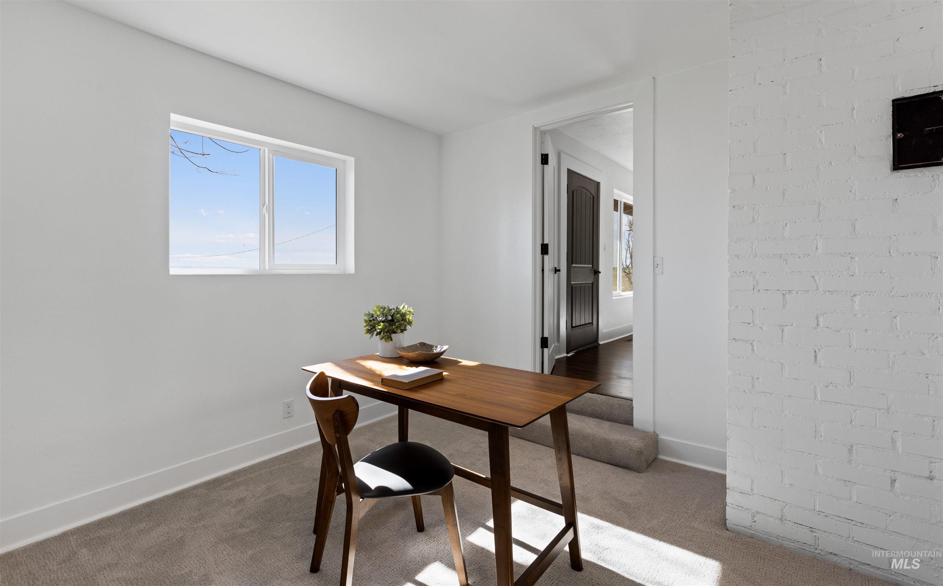 29862 Emmett Road Caldwell, ID 83607 - Photo 40 of 44 Home office featuring light carpet and baseboards