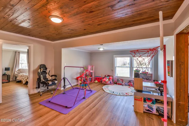 a very nice looking room with furniture and wooden floor