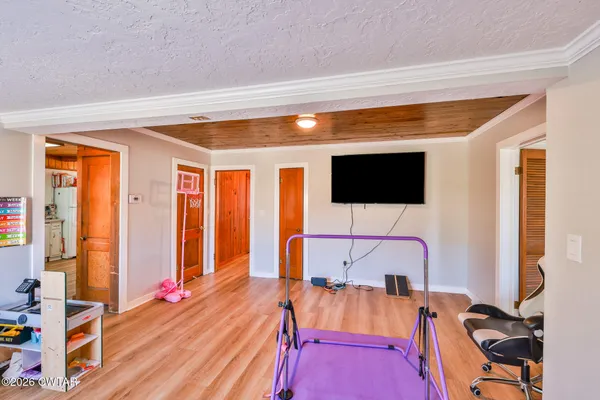 a view of a livingroom with furniture and a flat screen tv