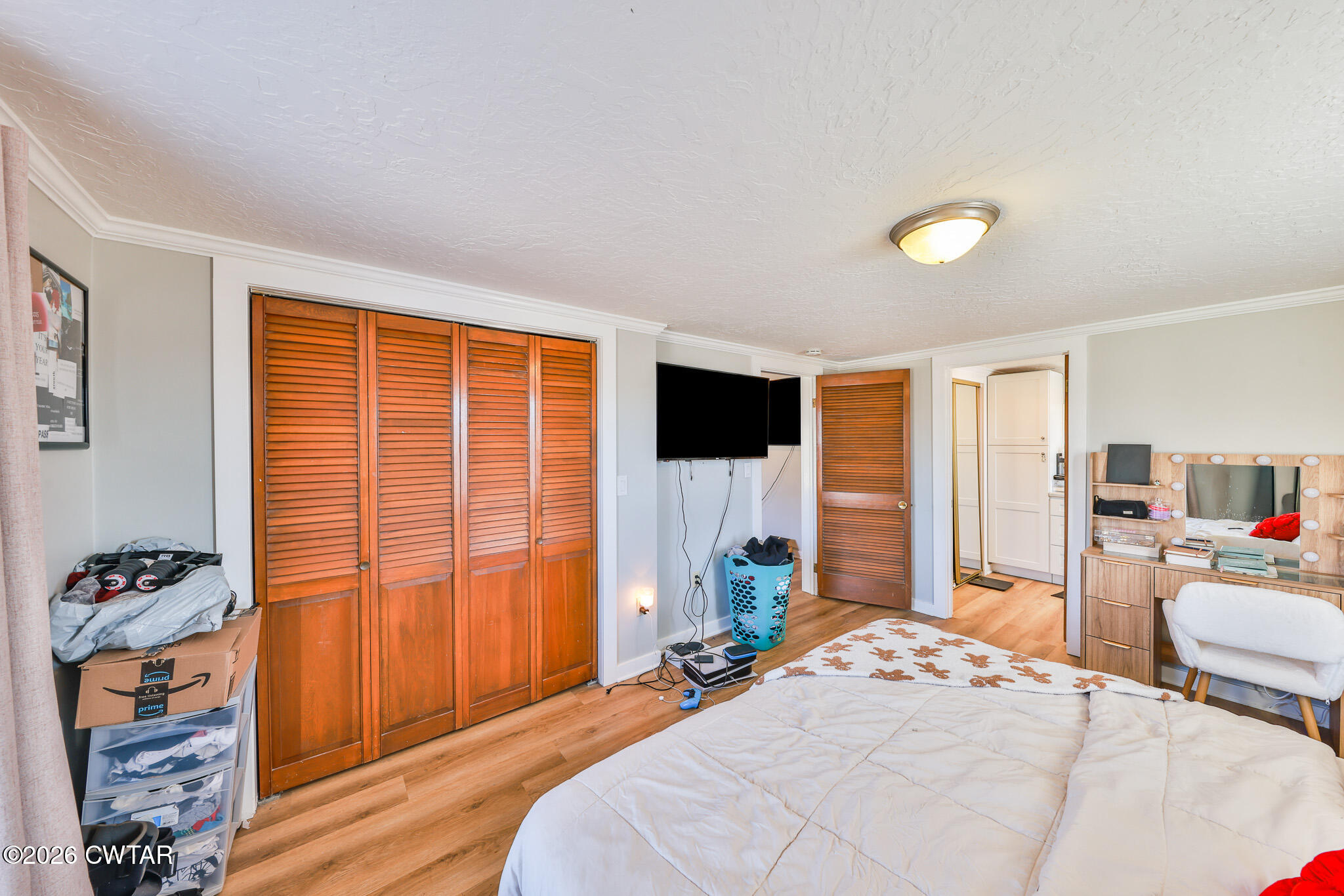150 West Locust Street Dresden, TN 38225 - Photo 16 of 31 a bedroom with a bed and wooden floor
