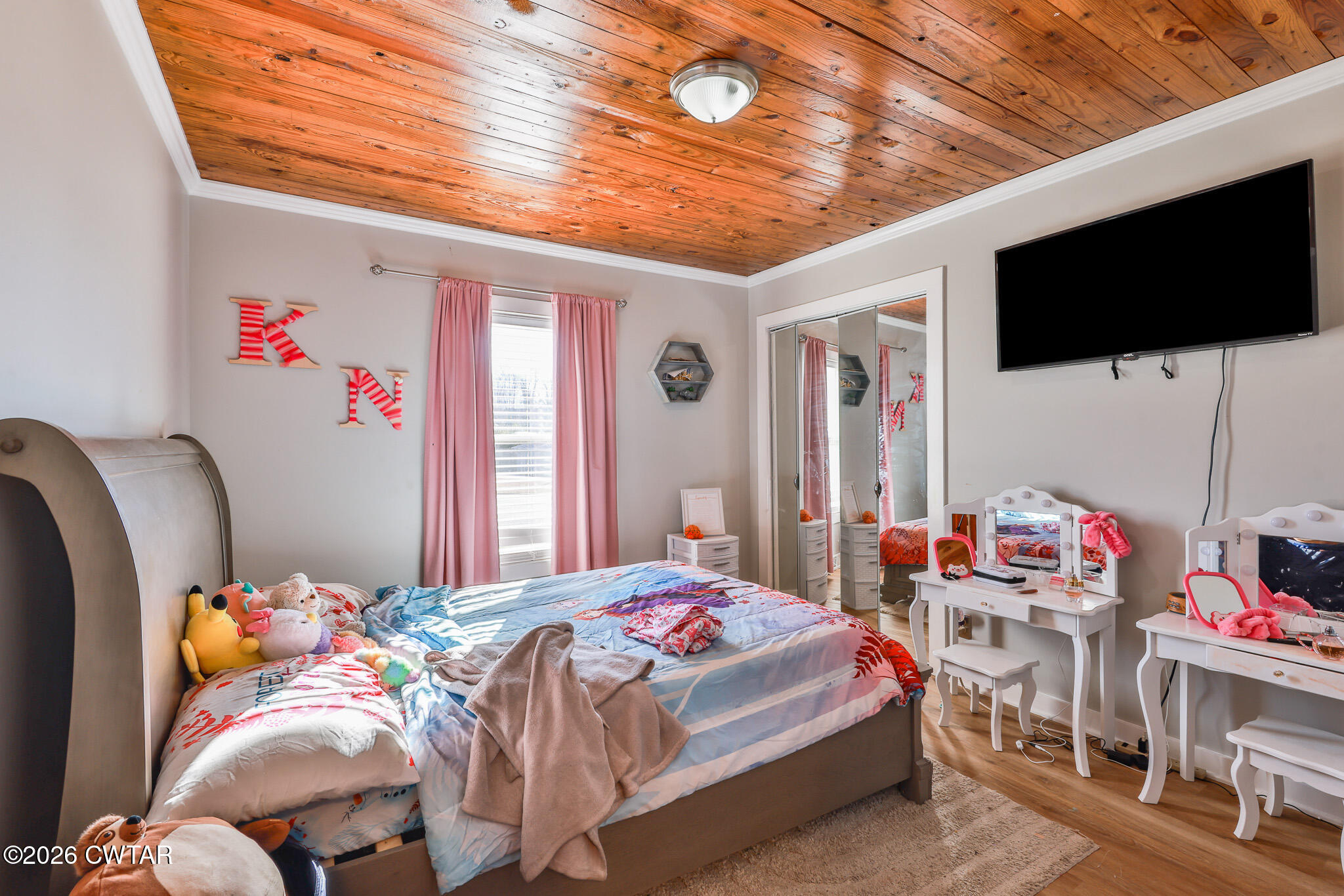 150 West Locust Street Dresden, TN 38225 - Photo 19 of 31 a bedroom with a bed and flat screen tv