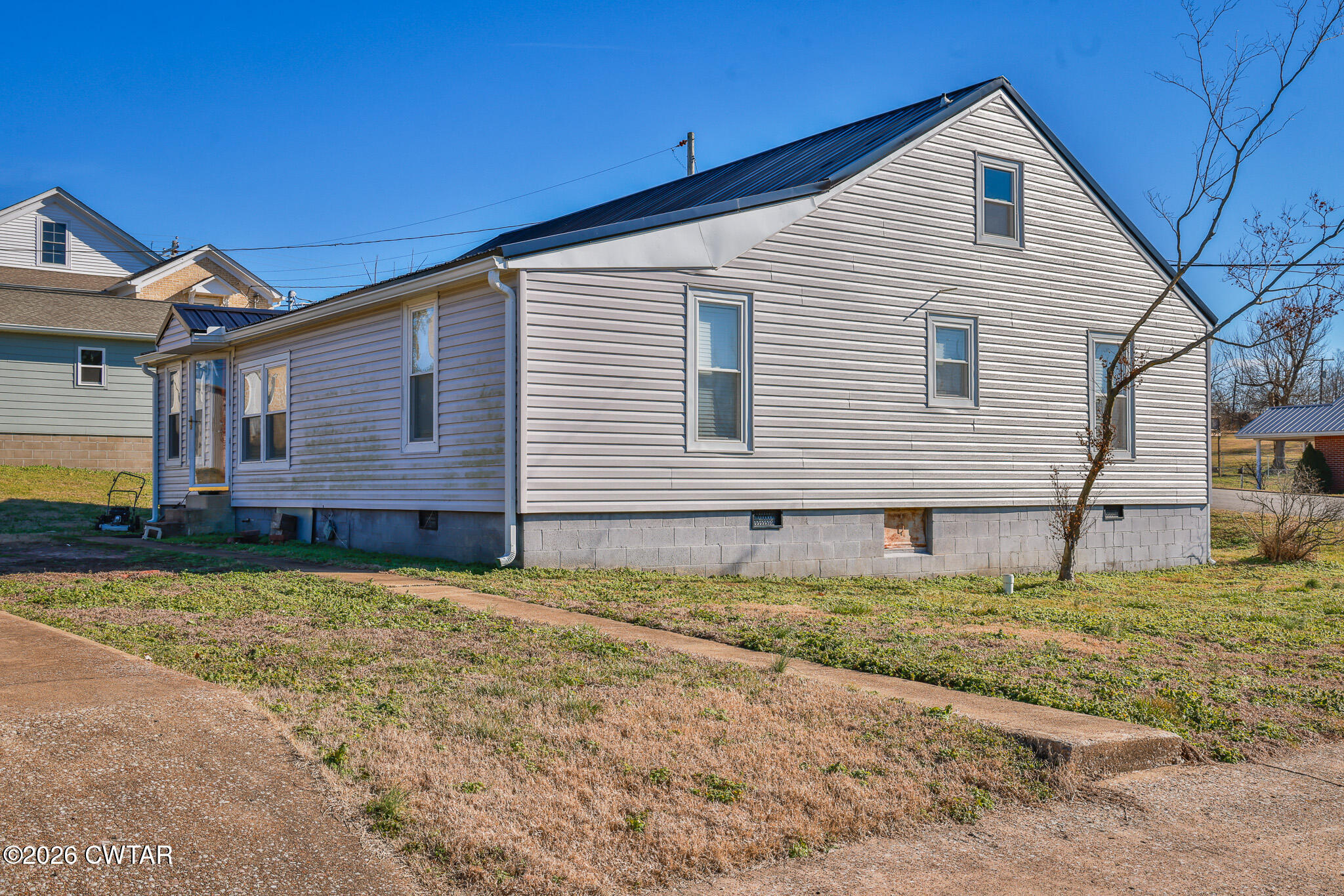 150 West Locust Street Dresden, TN 38225 - Photo 27 of 31 a view of a house with a yard